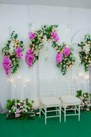 flower arrangements as a backdrop for wedding celebrations in Indonesia. photo