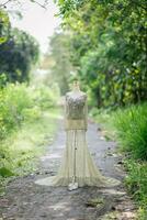 Dress Details. Green wedding dress on mannequin. photo