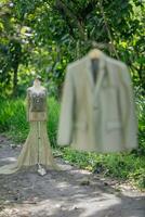 Dress Details. Green wedding dress on mannequin. photo