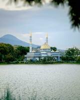 Indonesian Islamic Mosque between rivers or lakes. photo