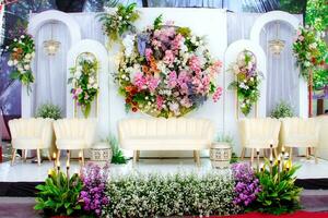 Wedding decorations. Wedding backdrop with flowers and Indonesian wedding decorations. photo