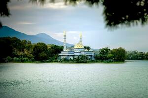 Indonesian Islamic Mosque between rivers or lakes. photo