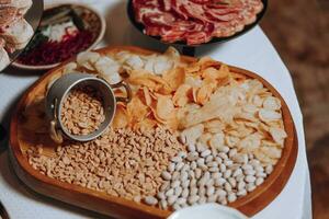 Snacks at the wedding, cheese, sausage, vegetables, meat products, Cossack table at the Ukrainian wedding. photo