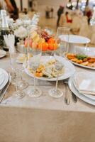 catering food table set decoration. Background. The foreground of napkins, dishes, toast, glasses. Calm atmosphere photo