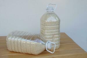 Two plastic bottles that contain grains of rice to prevent from dust or insects. DIY. Concept, reuse plastic bottle. Zero waste. photo