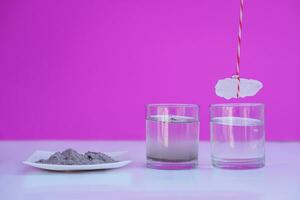Equipment for doing science experiment about sedimentation by using alum stone with ash water in glass.Concept, Education, Easy activity lesson for kids. Reaction of chemical substance in alum stone. photo