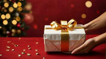 AI generated Woman hands holding elegant present gift box with golden ribbon on red background with gold bokeh photo