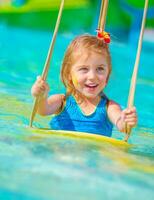 Cheerful girl in aqua-park photo