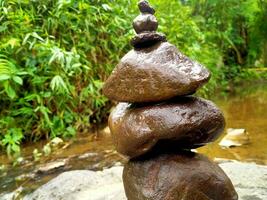 a stack of rocks sitting on top of a rock photo