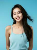 AI generated Portrait of beautiful asian woman on isolated light blue background, wearing tank top, beauty model photo