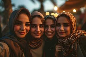 ai generado grupo de contento musulmán mujer vistiendo hijab tomando selfie con móvil teléfono a puesta de sol. generativo ai foto