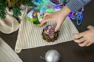 Close up shot of new year decorations. Little boy decorating christmas tree. New year changing numbers. Holiday photo