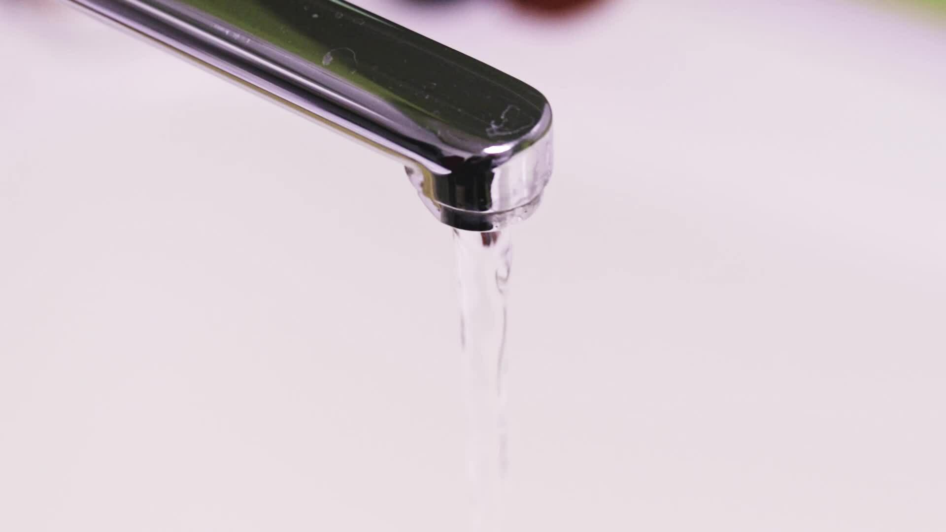 Slow motion footage of the water running from the tap. Concept 36432269