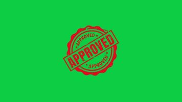 Red ink approved signed stamp animation on green screen background video