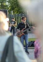 Moscow, Russia - 07.09.2023 - Visitors enjoying street band performance next to VDNKH metro station. Music photo