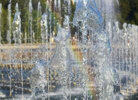 Close up shot of the fountain and the rainbow. Texture photo