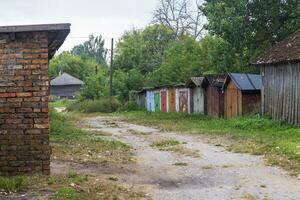 Shot of the old teared huts in the village. Rural photo