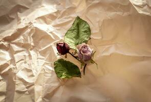 Concept shot of the background theme, wrapping paper, dried roses other flowers and other arrangements. Valentines day photo