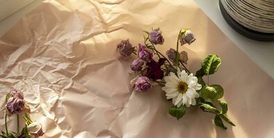 Concept shot of the background theme, wrapping paper, dried roses other flowers and other arrangements. Decoration photo