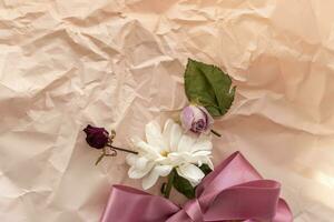 Concept shot of the background theme, wrapping paper, dried roses other flowers and other arrangements. Valentines day photo