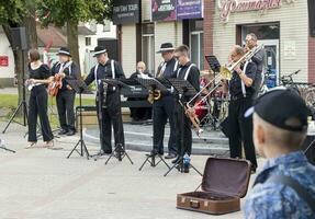 Brest, Belarus - 08.25.2023 - Jazz street band performing for public. Entertainment photo