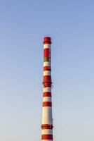 Concept shot of the chimney of thermal power plant. Industrial photo