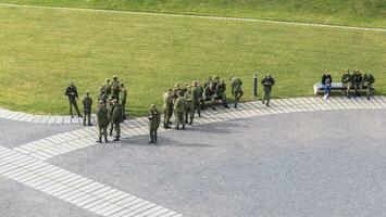 Mir, Belarus - 10.03.2023 - Group of the young recruited solders in the park. People photo