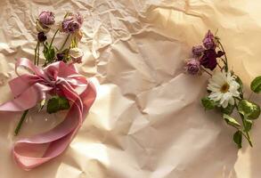 Concept shot of the background theme, wrapping paper, dried roses other flowers and other arrangements. Decoration photo