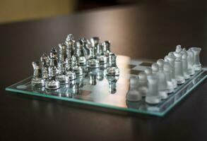 Close up shot of the chess board made of glass. Sports photo