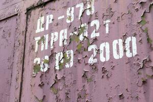 Close up shot of an old paint on the metal surface. Background photo