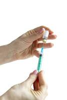 Close upshot of the woman preparing medicine for injection. Healthcare photo