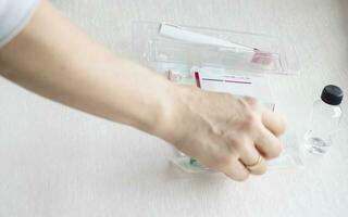 Close upshot of the woman preparing medicine for injection. Healthcare photo