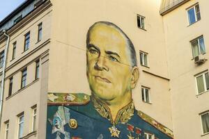 Moscow, Russia - 07.24.2023 - Portrait of the legendary marshal Zhukov on the building at the Arbat street. Street photo