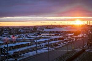 Brest, Belarus -11.25.2023 - Shot of the dramatic sunset in the rural city in the cold evening. Nature photo