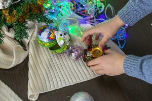 Close up shot of new year decorations. Little boy decorating christmas tree. New year changing numbers. Holiday photo