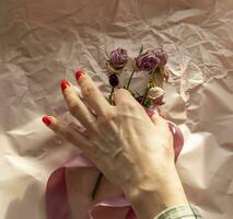 Concept shot of the background theme, wrapping paper, dried roses other flowers and other arrangements. Decoration photo