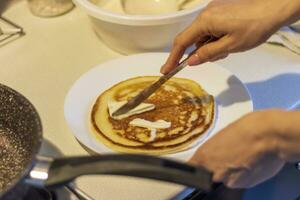 Close up shot of a pancakes being baked on the kitchen. Food photo