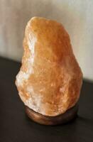 Close up shot of the salt lamp on the shelf. Concept photo