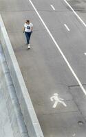 Moscow, Russia - 07.09.2023 - Concept shot of the woman walking down the street. People photo