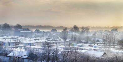 paisaje Disparo de el invierno aldea. temporada foto