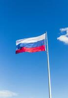 Close up shot of the Russian flag floating on the wind. Country photo