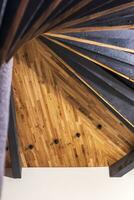 Concept shot of the wooden spiral staircase. Interior photo