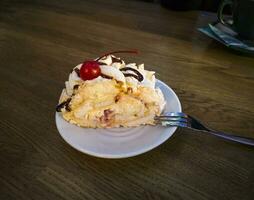 Delicious meringue roll dessert on a plate. Food photo