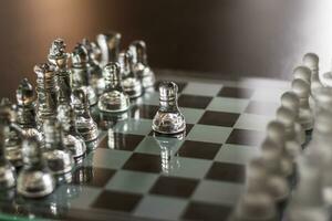 Close up shot of the chess board made of glass. Sports photo