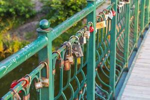 Metal structure where couples locking the locks as a sign of true love. Faith photo