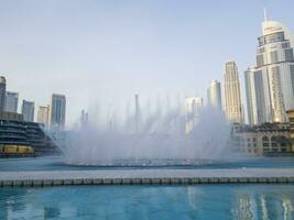 Dubai, UAE - 06.10.2023 - Famous dancing Dubai fountain, with Dubai Opera on foreground. UAE. Landmark photo