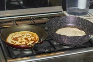 Close up shot of a pancakes being baked on the kitchen. Food photo