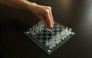 Close up shot of the chess board made of glass, Game photo