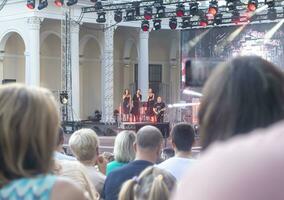 Moscow, Russia - 07.28.2023 - Concert of the rock band at VDNKH park. Urban photo