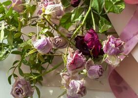 Concept shot of the background theme, wrapping paper, dried roses other flowers and other arrangements. Wedding photo